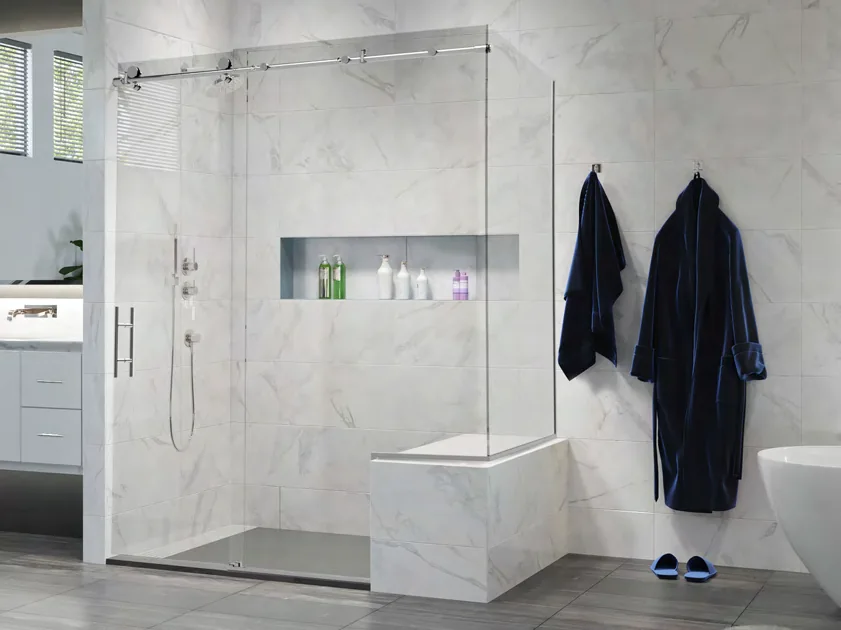 Agalite Transcend sliding shower enclosure with a glass return above a tiled half-wall